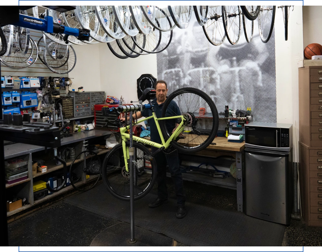 Man repairing bike in workshop