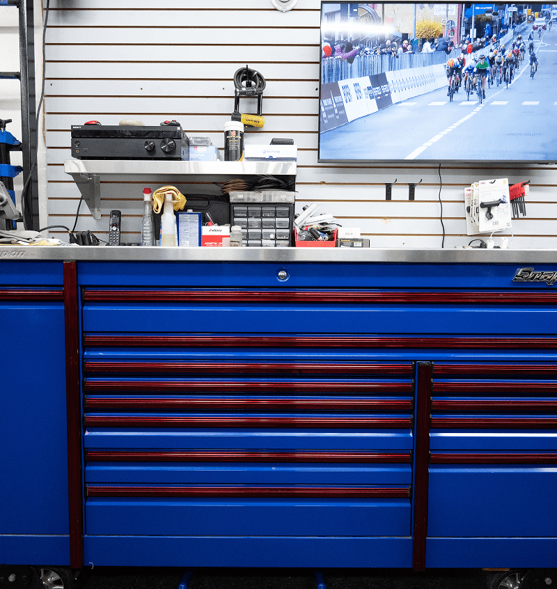 Workshop with blue tool cabinet and screen