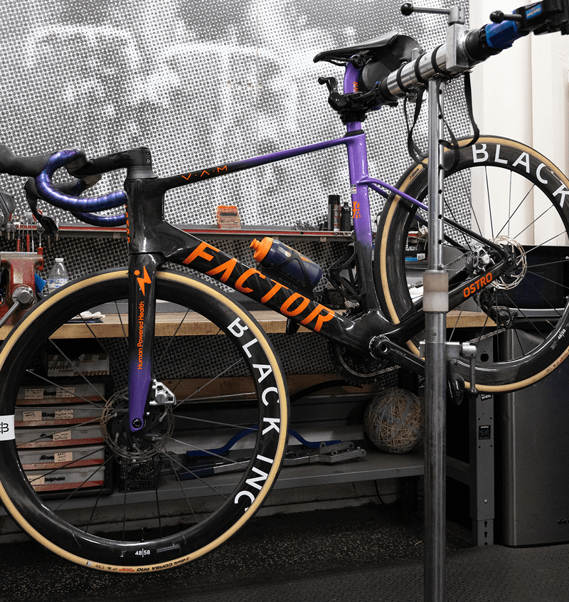 Bicycle on repair stand in workshop